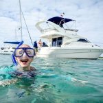 person smiling with snorkeling mask during aluxury private yacht rental playa del carmen riviera maya mexico