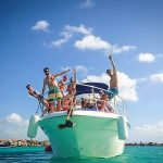 group of happy people onboard a luxury private yacht rental playa del carmen riviera maya mexico