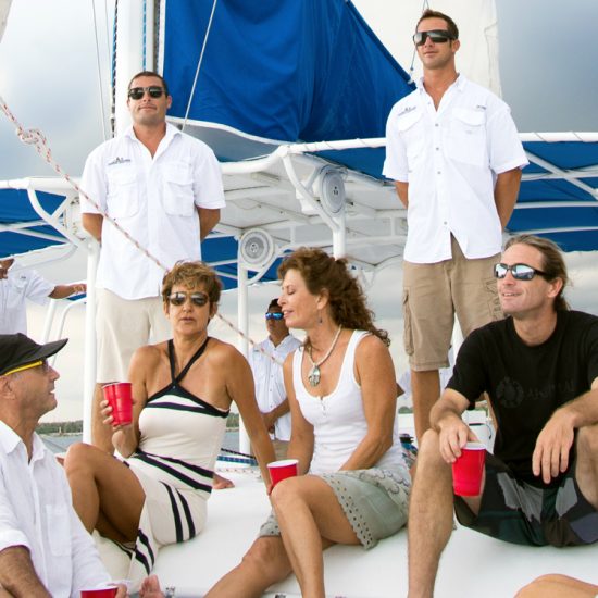 people celebrating during a private catamaran tour in riviera maya, mexico