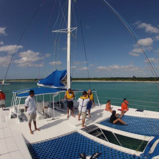 group of people onboard private catamaran rental puerto Morelos Maya catamaran cruise