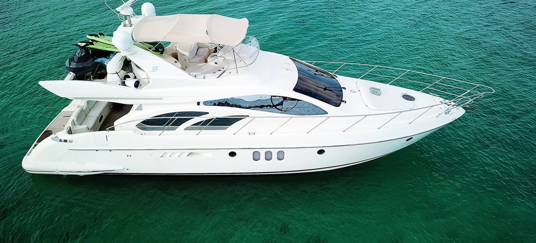 side view of a luxury 56ft belle yacht rental riviera maya mexico