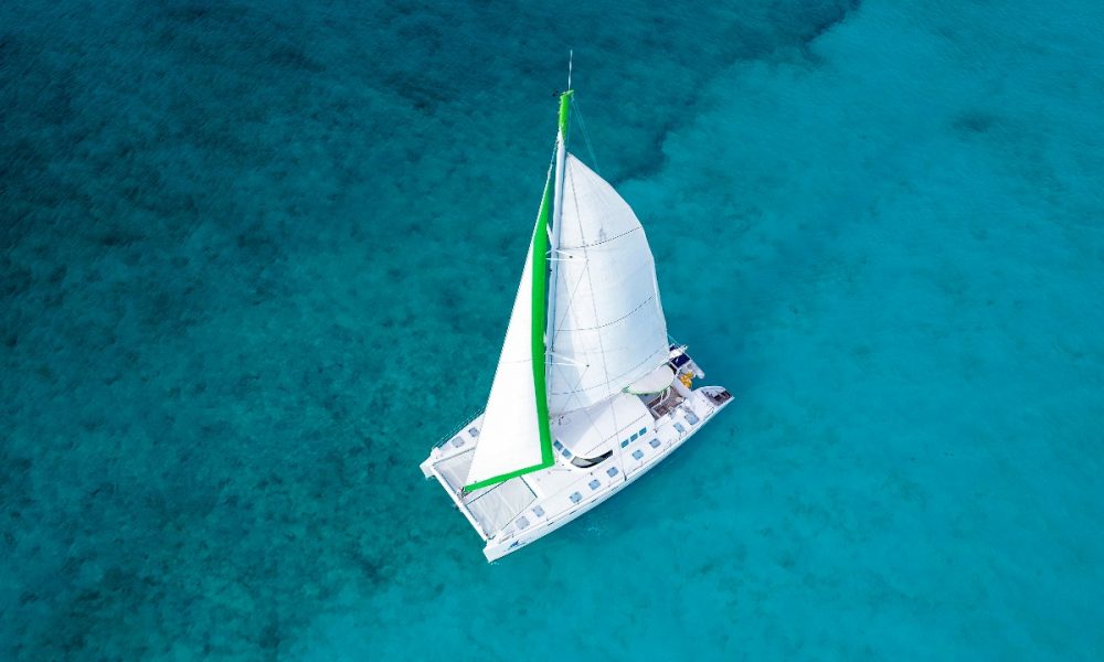 aerial view of tiare catamaran for rent, during a sail from cancun to isla mujeres