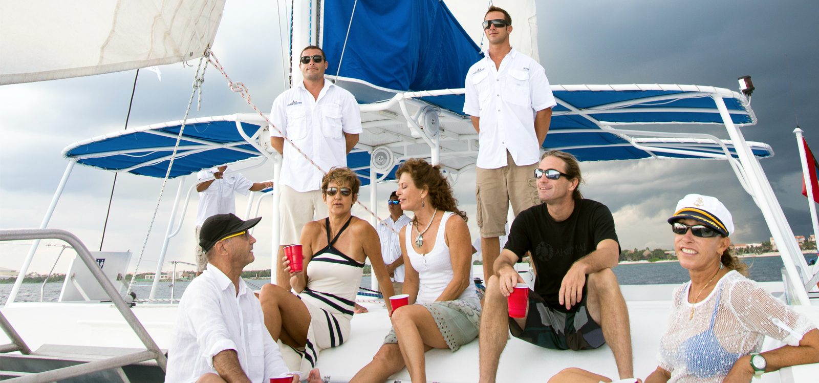 people celebrating during a private catamaran tour in riviera maya, mexico
