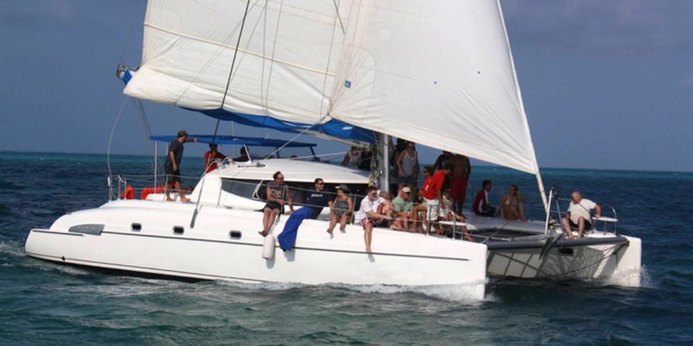 guests chilling on catamaran for rent in cozumel mexico