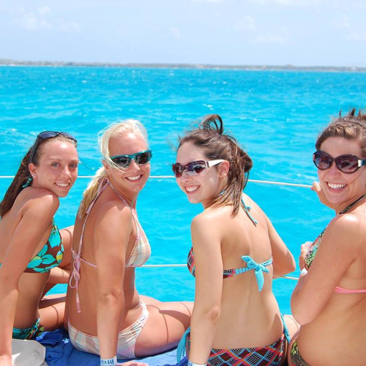 women on catamaran 1 cancun isla mujeres riviera maya catamarans